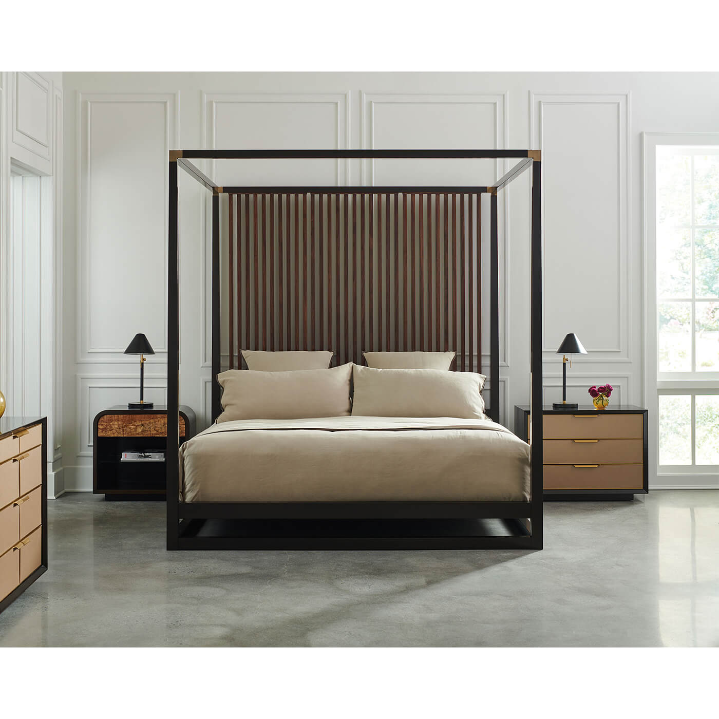 Modern canopy bed in spacious bedroom, polished floor.
