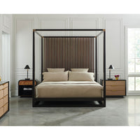 Modern canopy bed in spacious bedroom, polished floor.