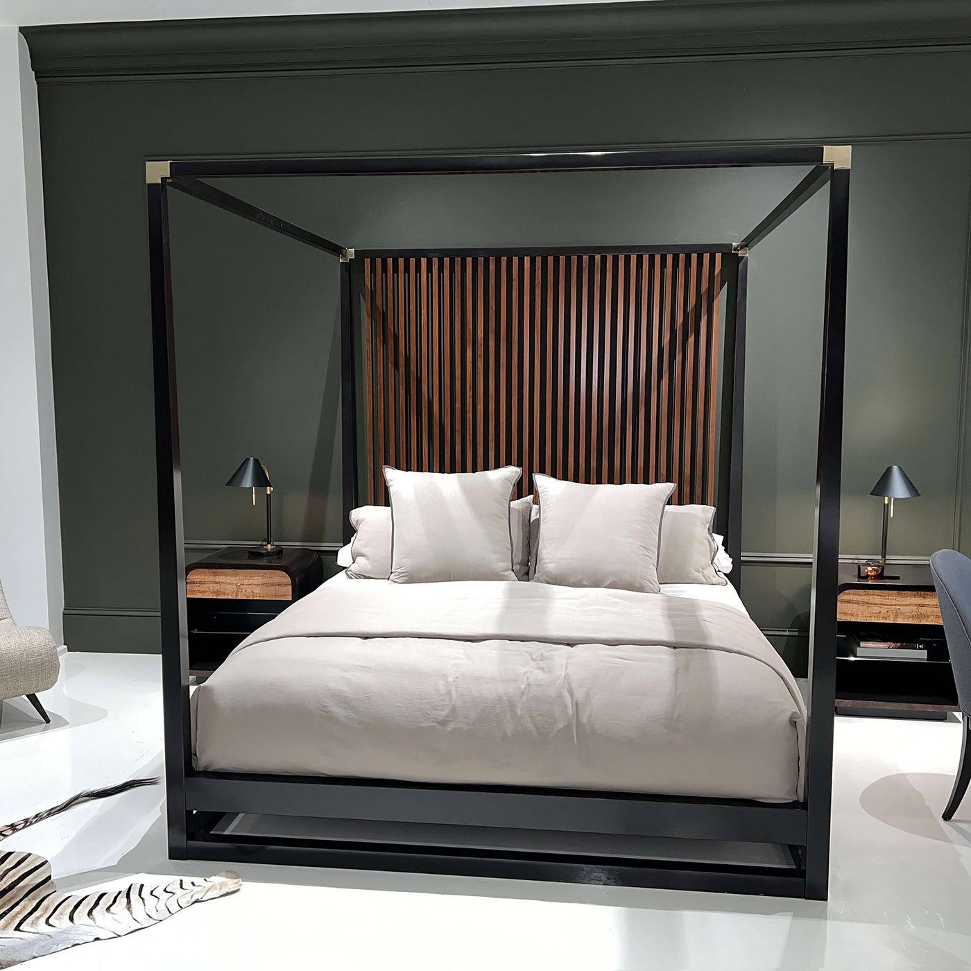 Front view of canopy bed, soft pillows displayed.