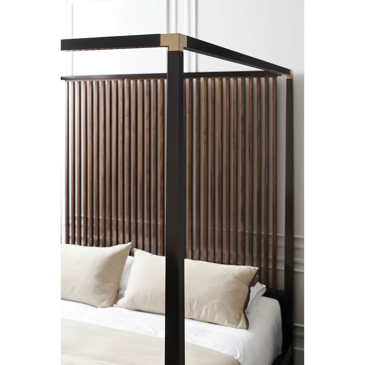 Close-up canopy bed frame, headboard detail.