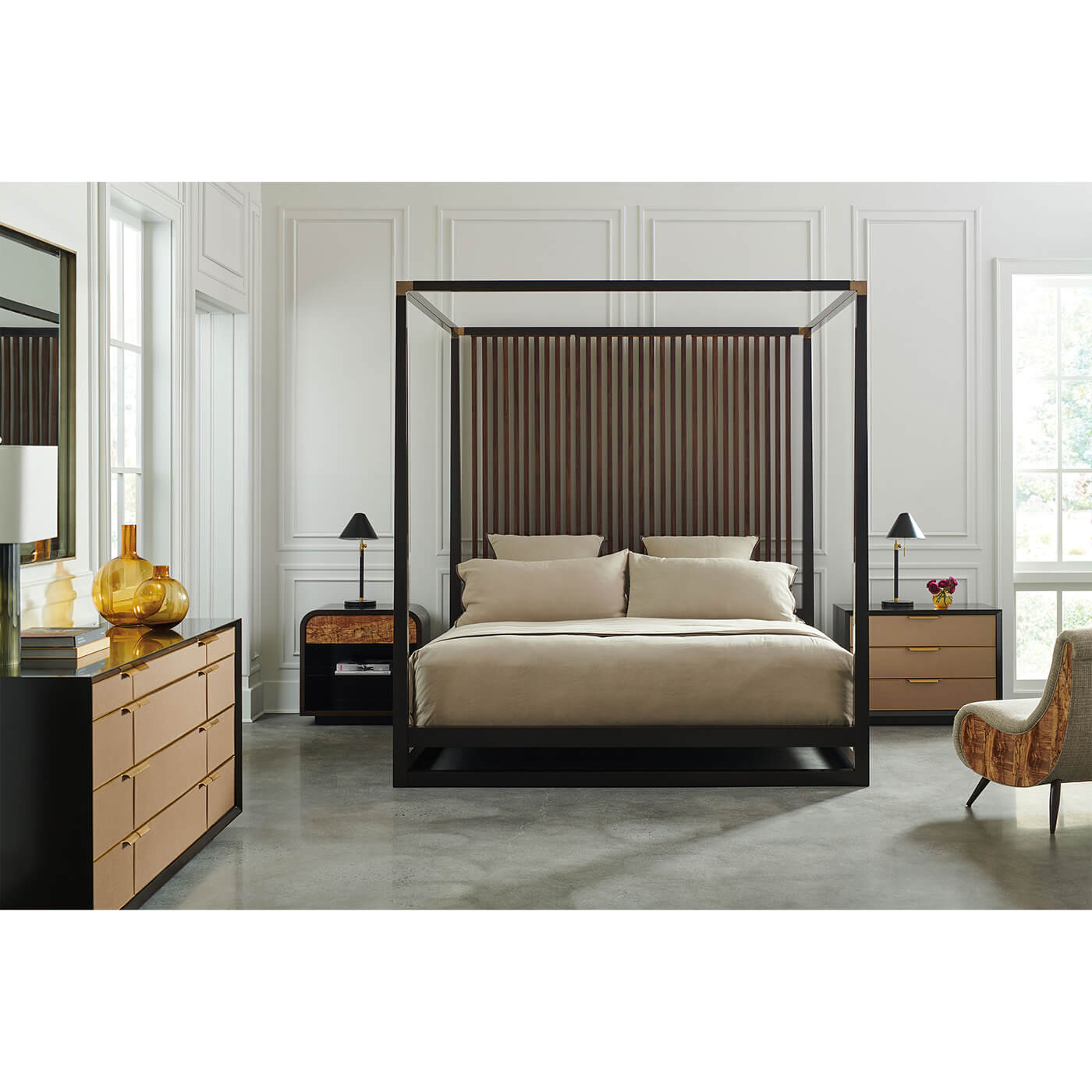 Canopy bed in styled bedroom, neutral decor.