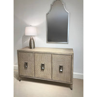 Mid-century modern credenza under mirror, with lamp decoration.