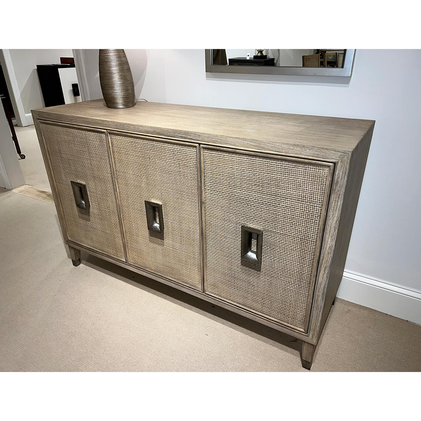 Angled view of mid-century modern credenza in room setting.