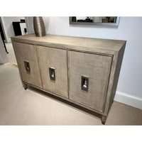 Angled view of mid-century modern credenza in room setting.