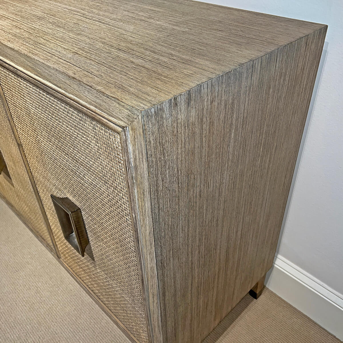 Close-up of credenza's wood grain texture and top.