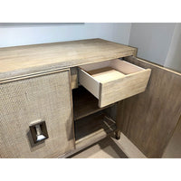 Open drawer in mid-century modern credenza, showing interior.