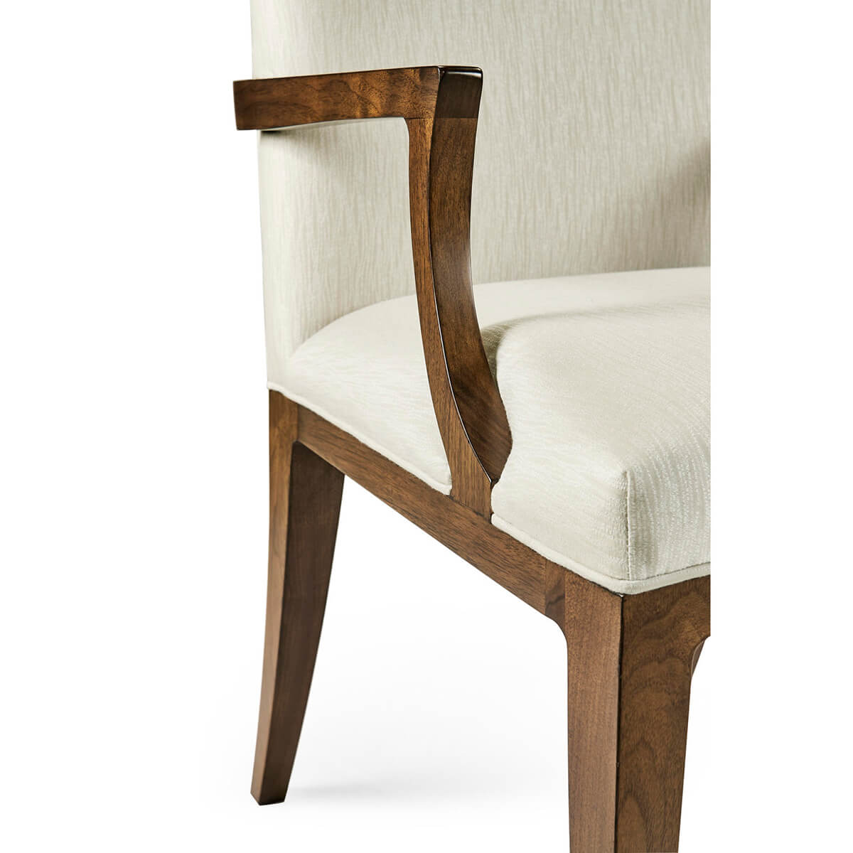 Detailed view of armchair armrest and seat.