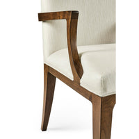 Detailed view of armchair armrest and seat.