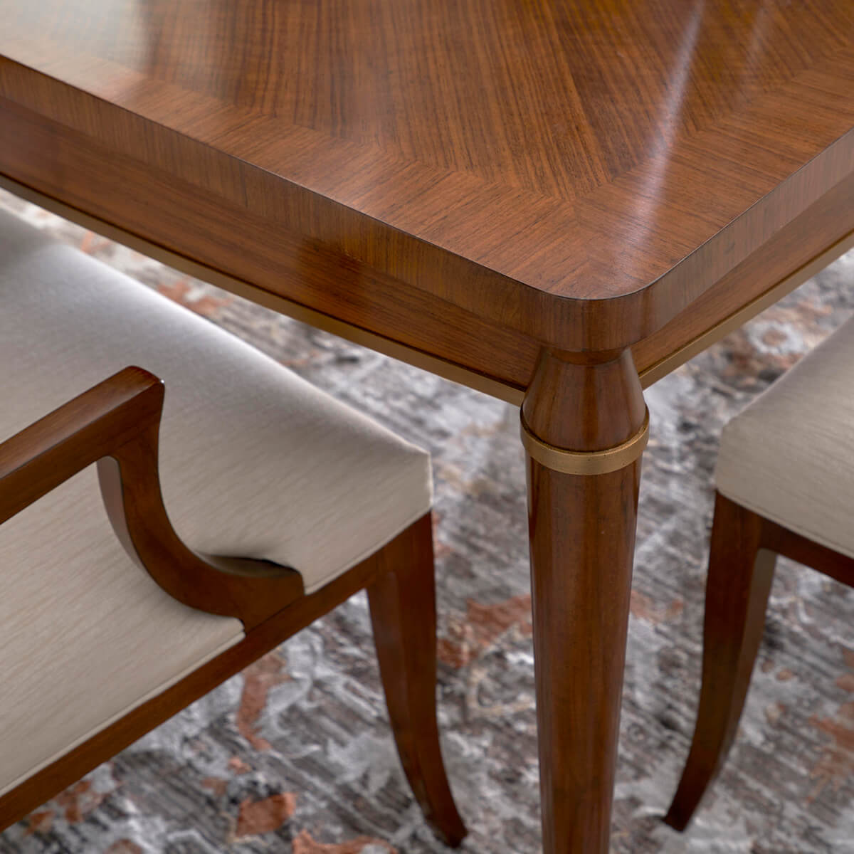 Close-up of dining table with armchair detail.