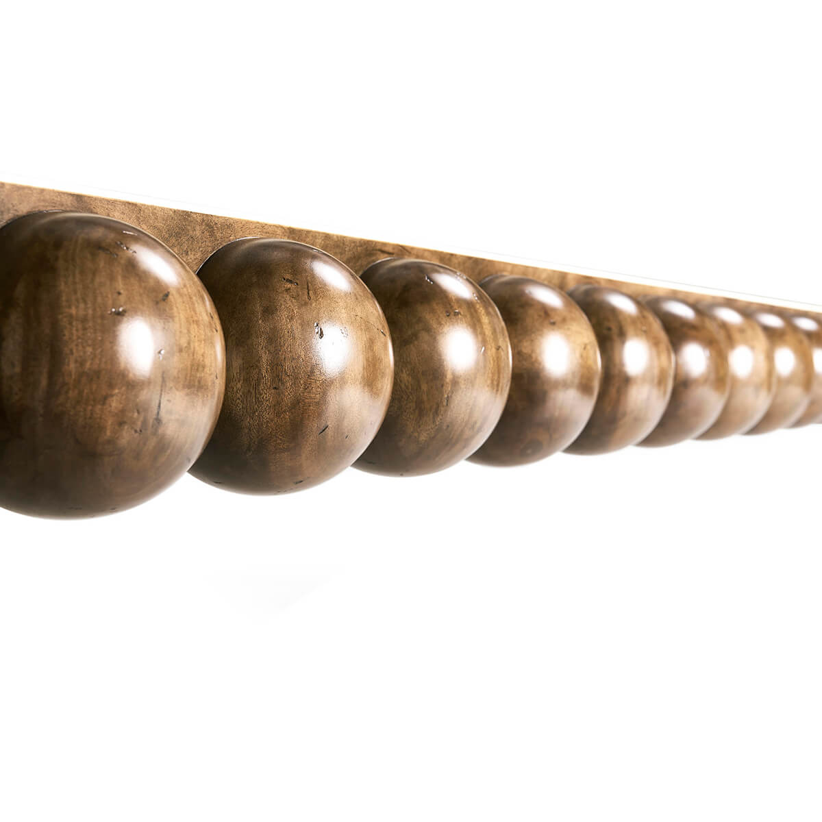 Close-up of spherical leg details on dining table.