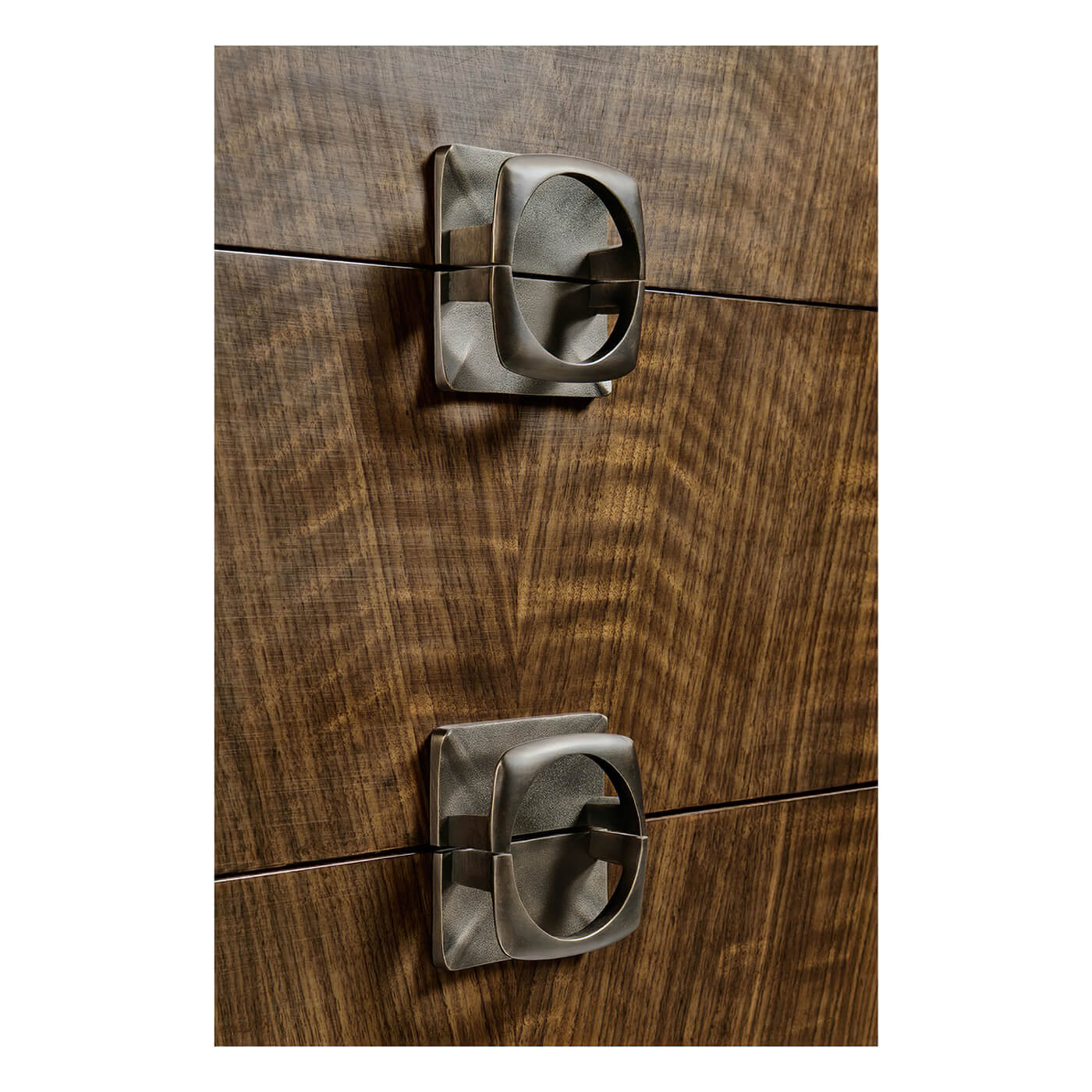 Detailed view of dresser drawer handles, mid century modern style.