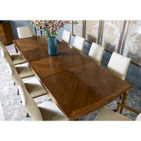 Top view of extended dining table with chairs.