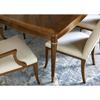 Close-up of table corner with chairs.