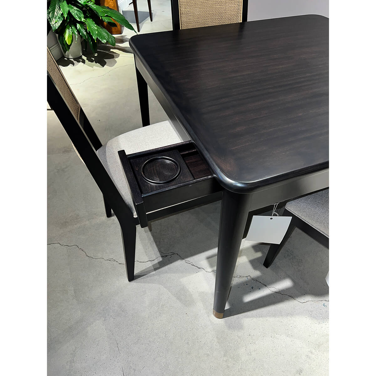 Game table drawer opened showing cup holder insert.