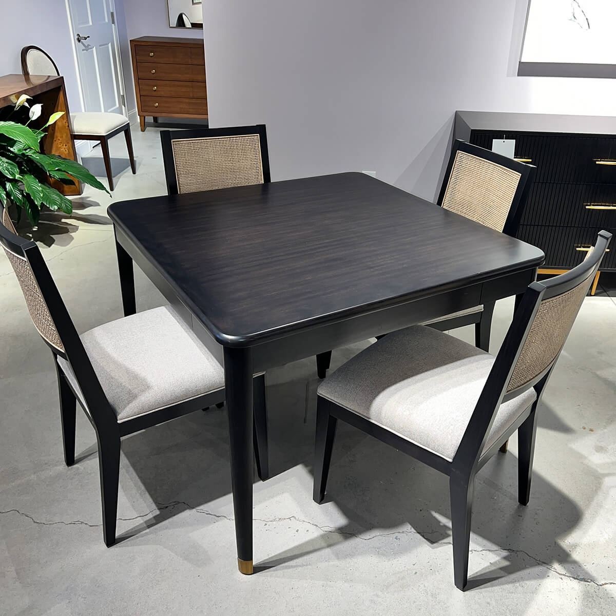 Espresso game table set with four chairs.