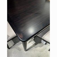 Close-up of espresso-finished game table corner detail.
