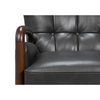 Armchair seat with button-tufted back in gray leather.