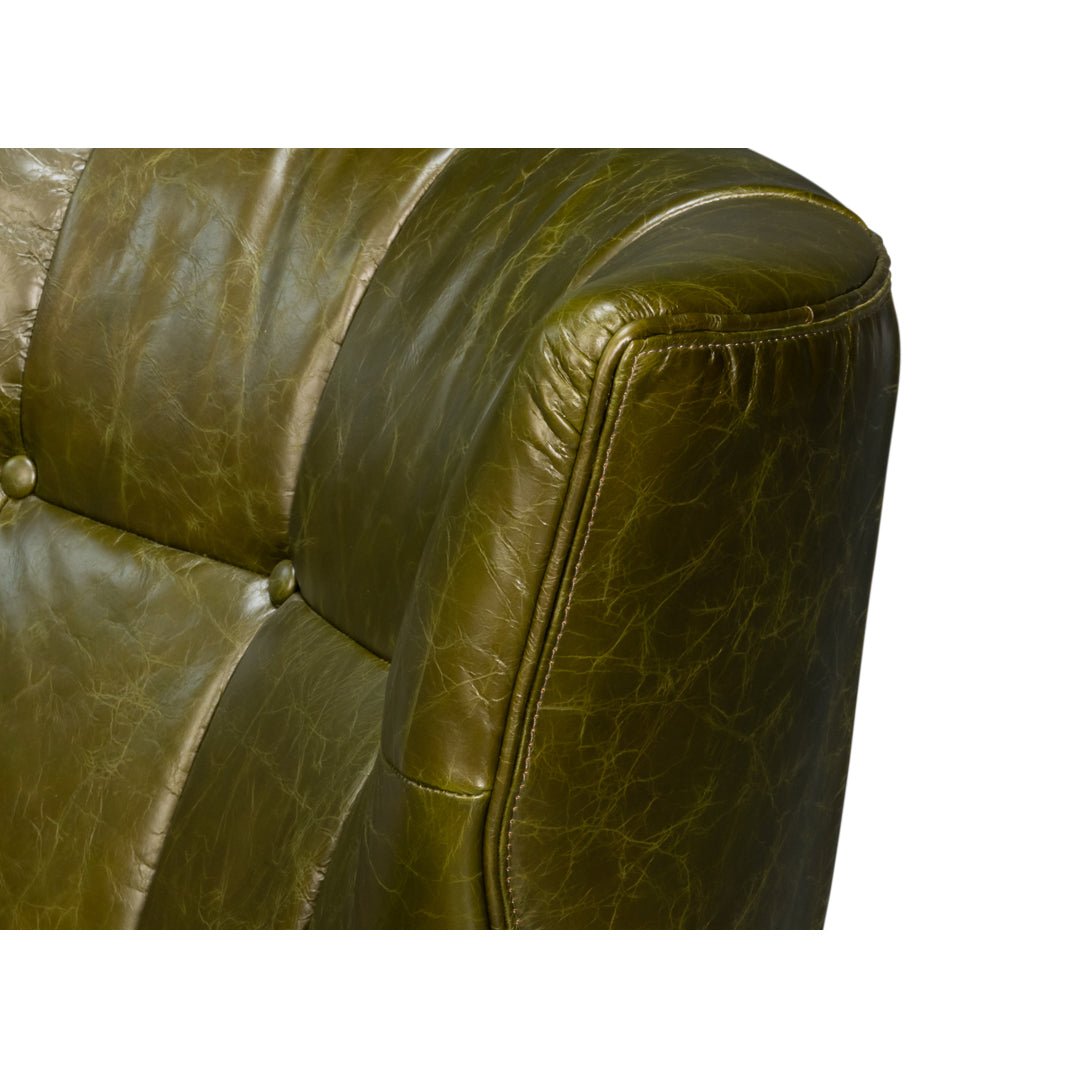 Corner close-up of armchair's button-tufted leather detail.