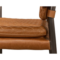 Close-up side detail of Mid-Century armchair cushion stitching.