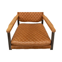 Top view of quilted leather armchair seat and armrests.
