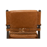 Back detail of Mid-Century armchair with leather buckle.