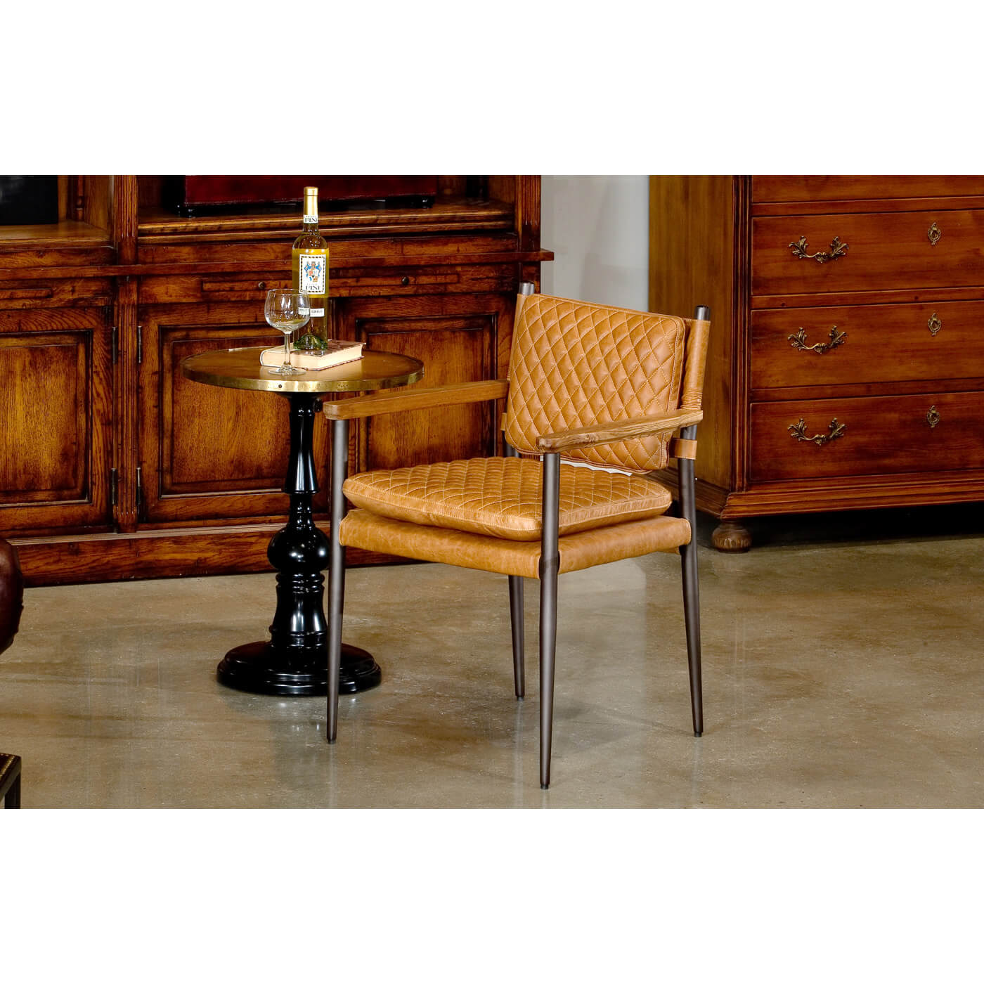 Mid-Century leather armchair beside small table in room.