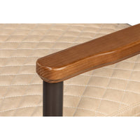 Mid-Century chair arm detail, wood finish.