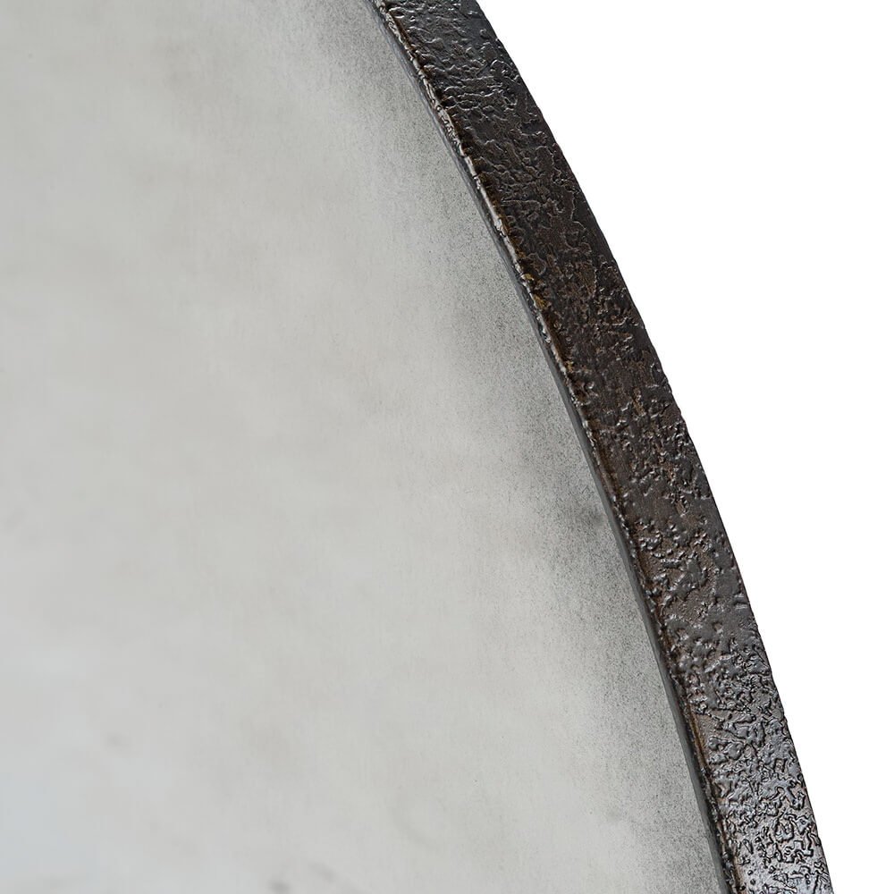 Close-up of mid-century modern mirror textured edge.