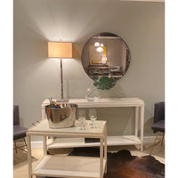 Mid-century modern mirror in stylish living room setting.