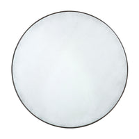 Round mid-century modern mirror with metallic frame.