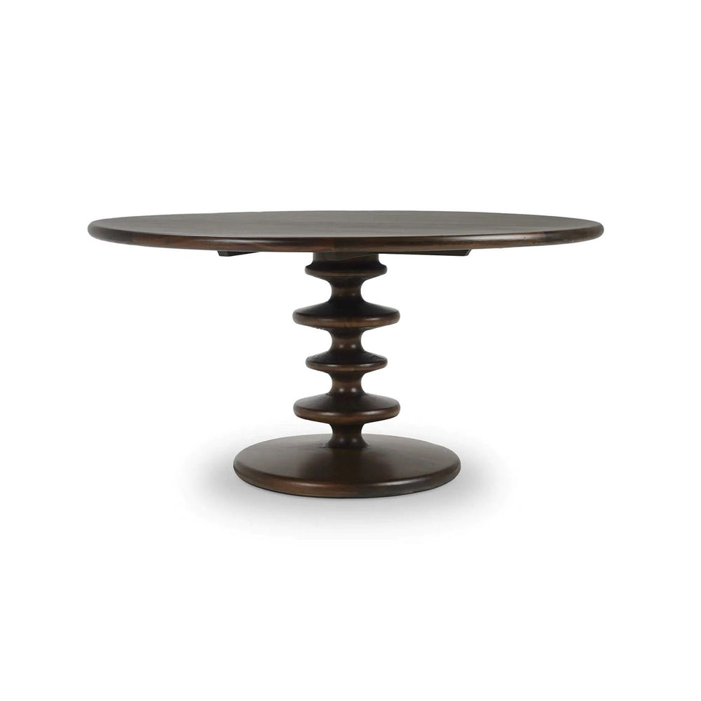 Dark wood round dining table with unique pedestal design.