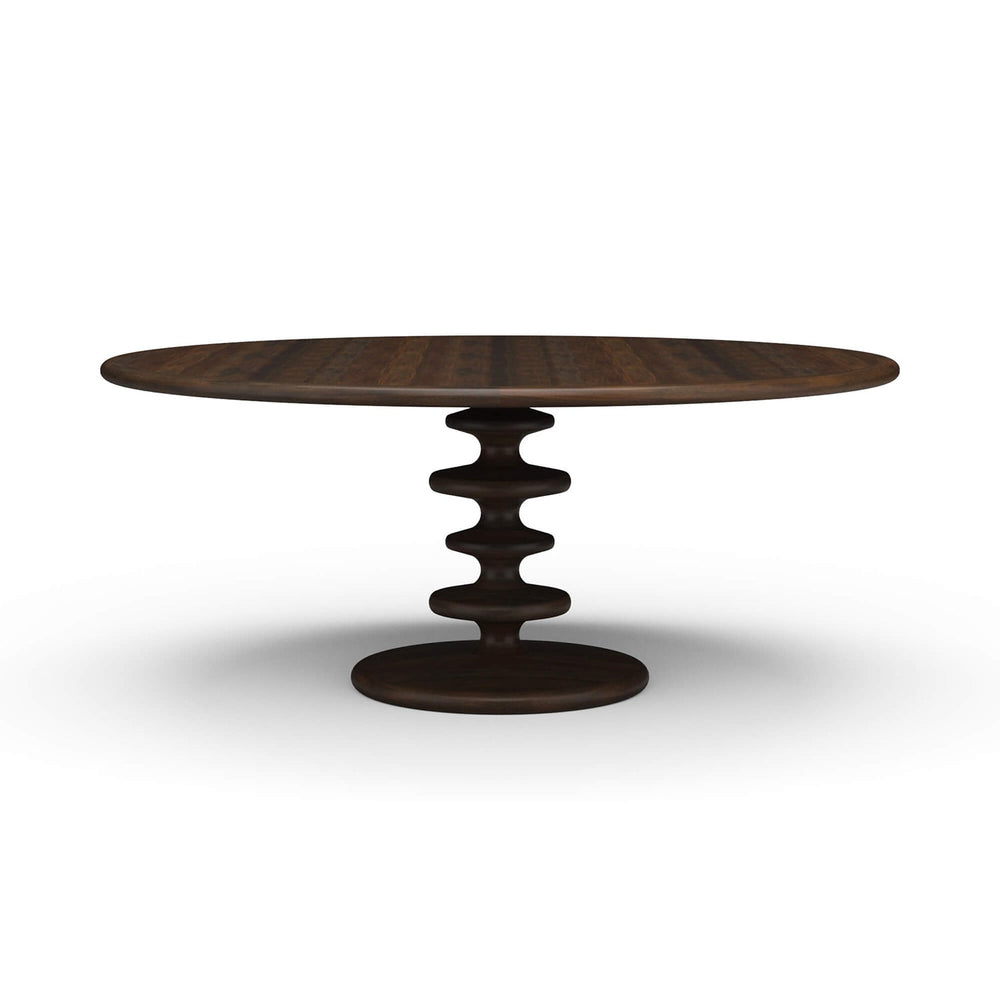 Dark round dining table with unique central pedestal design.