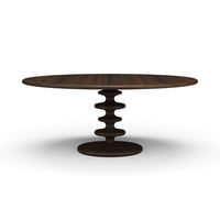 Dark round dining table with unique central pedestal design.