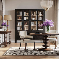 Dining room with modern round table and chairs.
