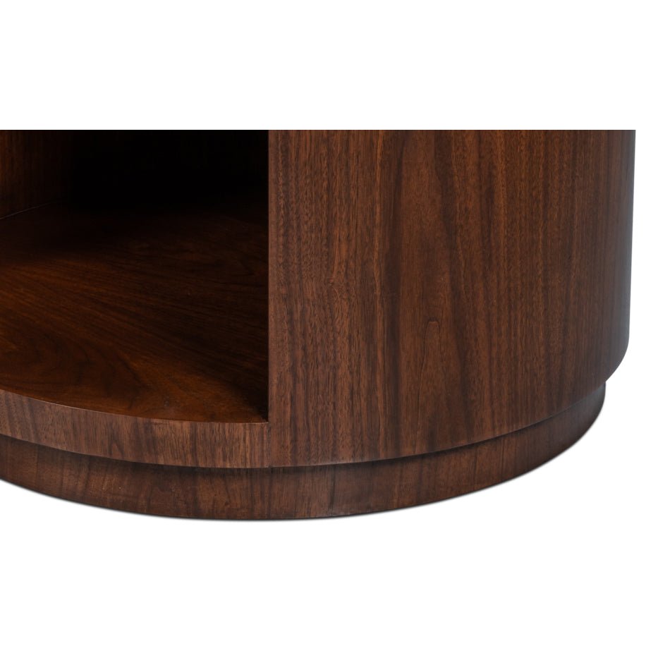 Base detail of round end table, wood grain visible.