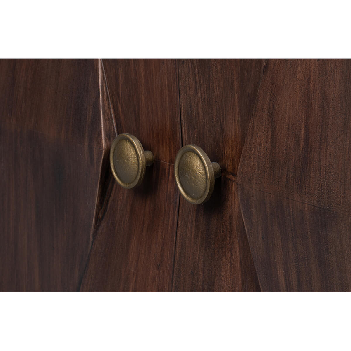 Close-up of round brass knobs on sideboard