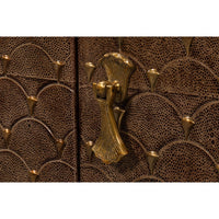 Detailed shot of sideboard door handle and texture.