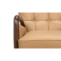 Close-up, armchair seat cushion, wooden armrest detail.