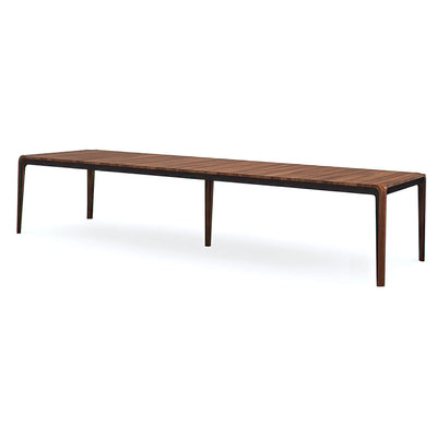 Long walnut dining table side view, mid-century modern style.