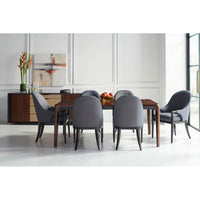 Dining chairs around walnut table, mid-century modern setup.