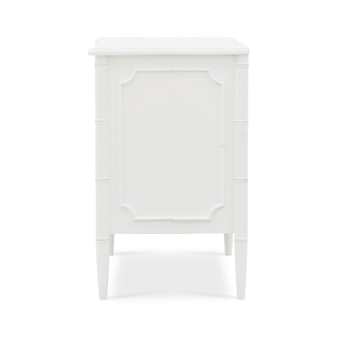 Side view of white painted nightstand, panel design.