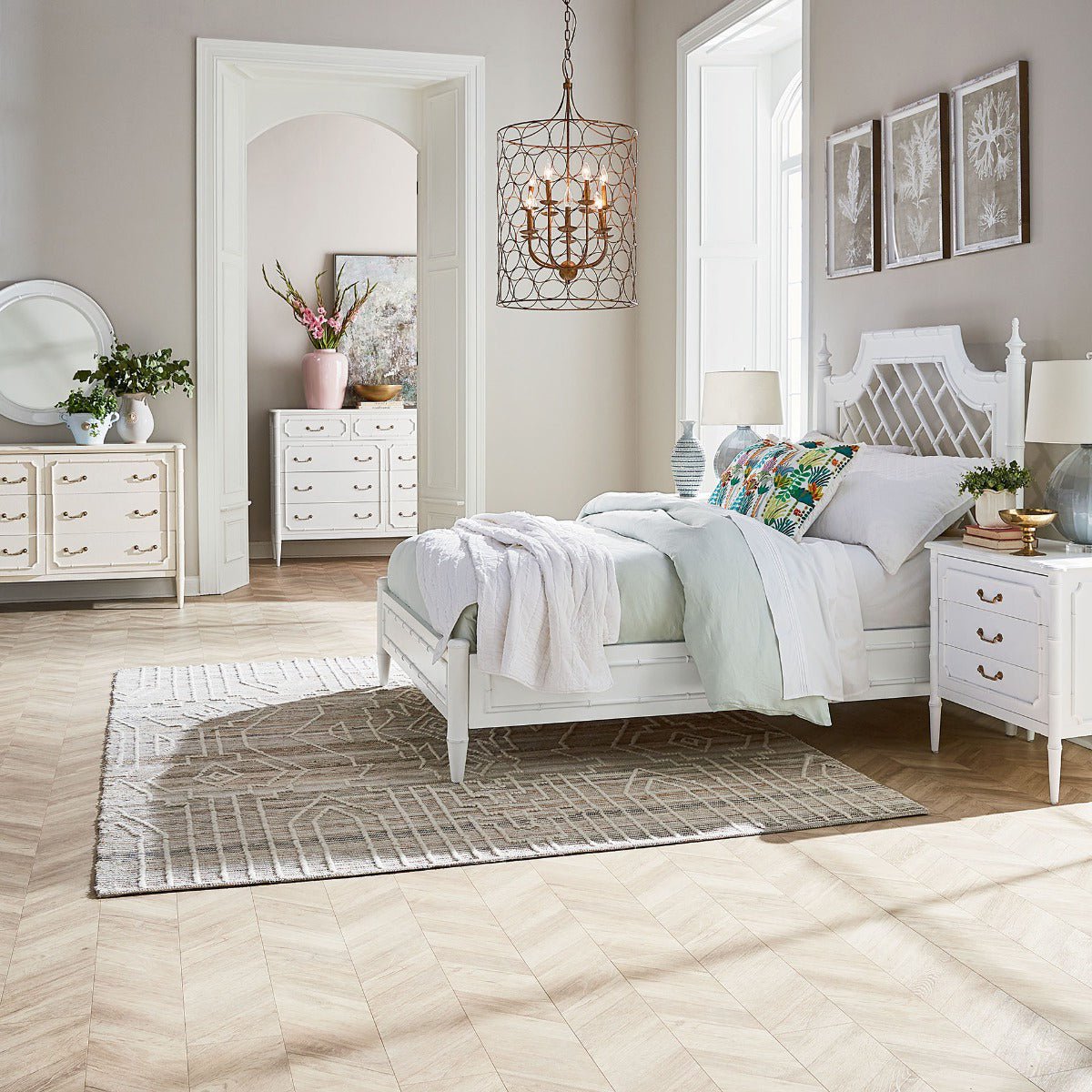 Bedroom scene featuring white mid-century modern furniture set.