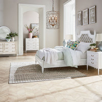 Bedroom scene featuring white mid-century modern furniture set.