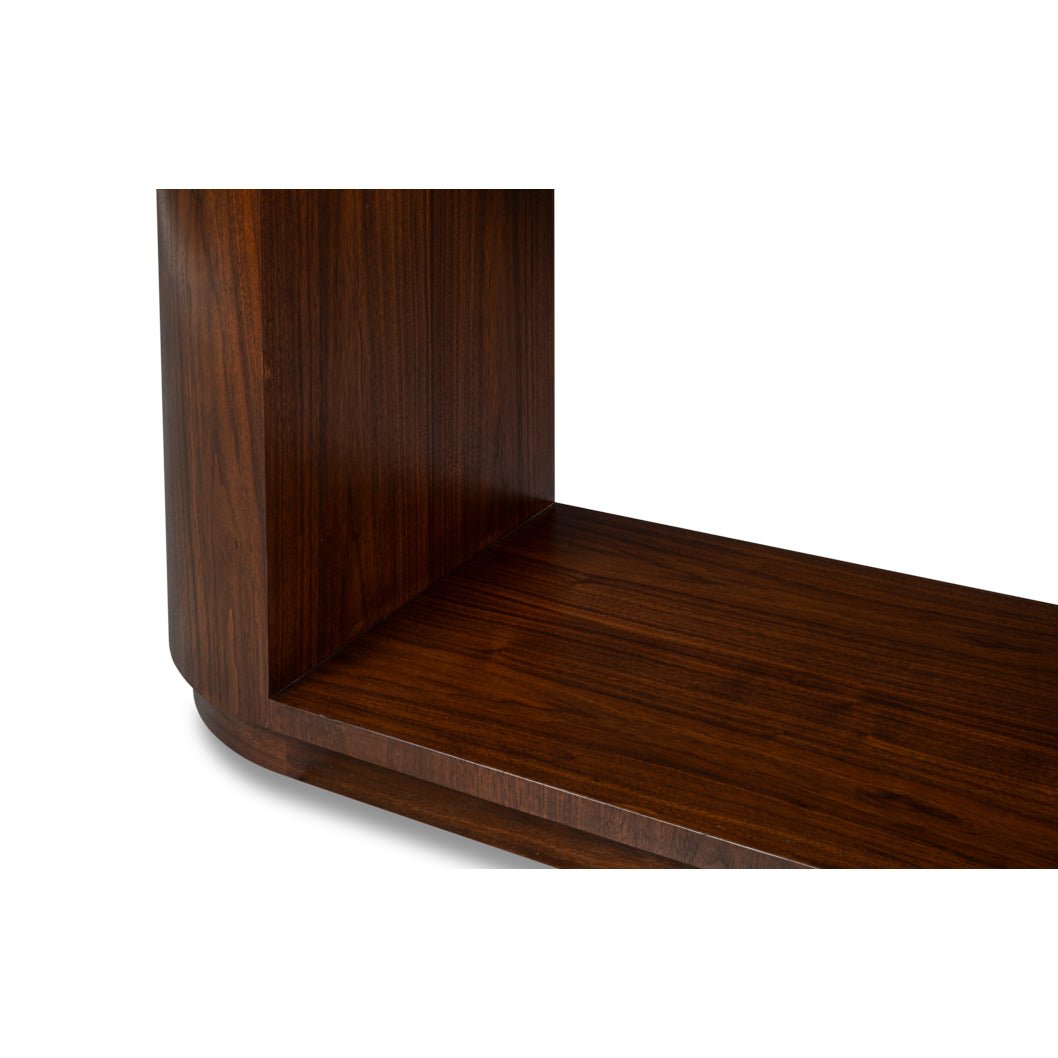 Interior corner of console table showing wood finish.
