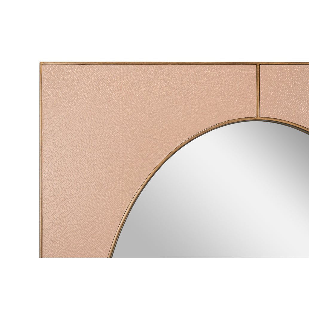 Close-up of leather mirror frame, detailed texture.