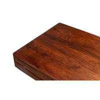Close-up of mid-century desk's wooden top surface.