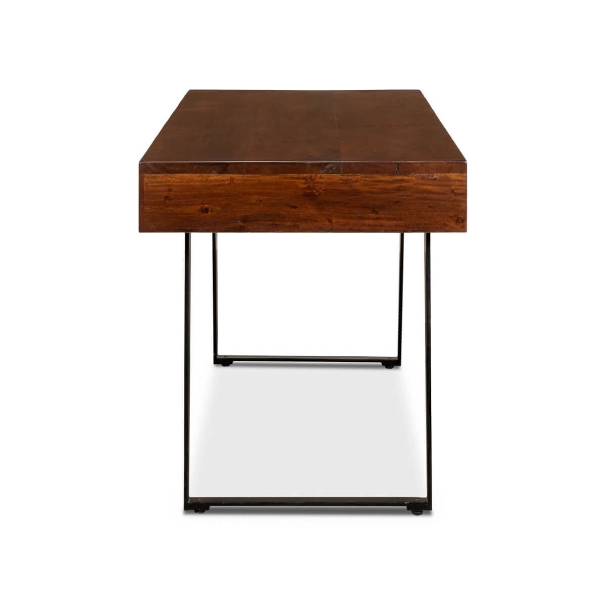 Side view of mid-century desk, wooden top, metal legs.