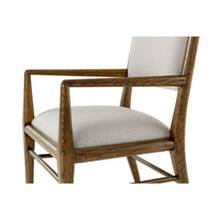 Close-up oak armchair arms, front detail.