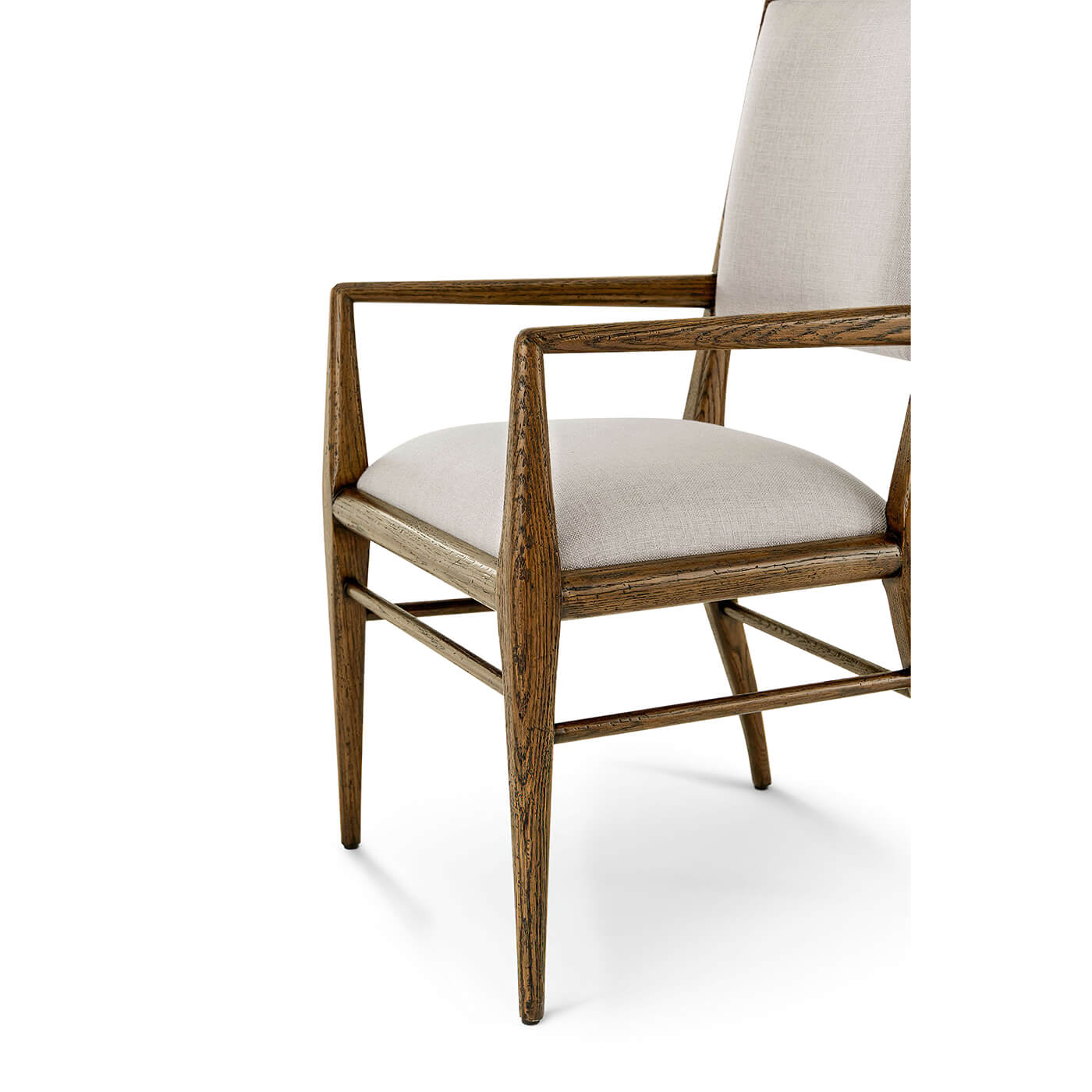 Close-up oak armchair seat and arms, side detail.