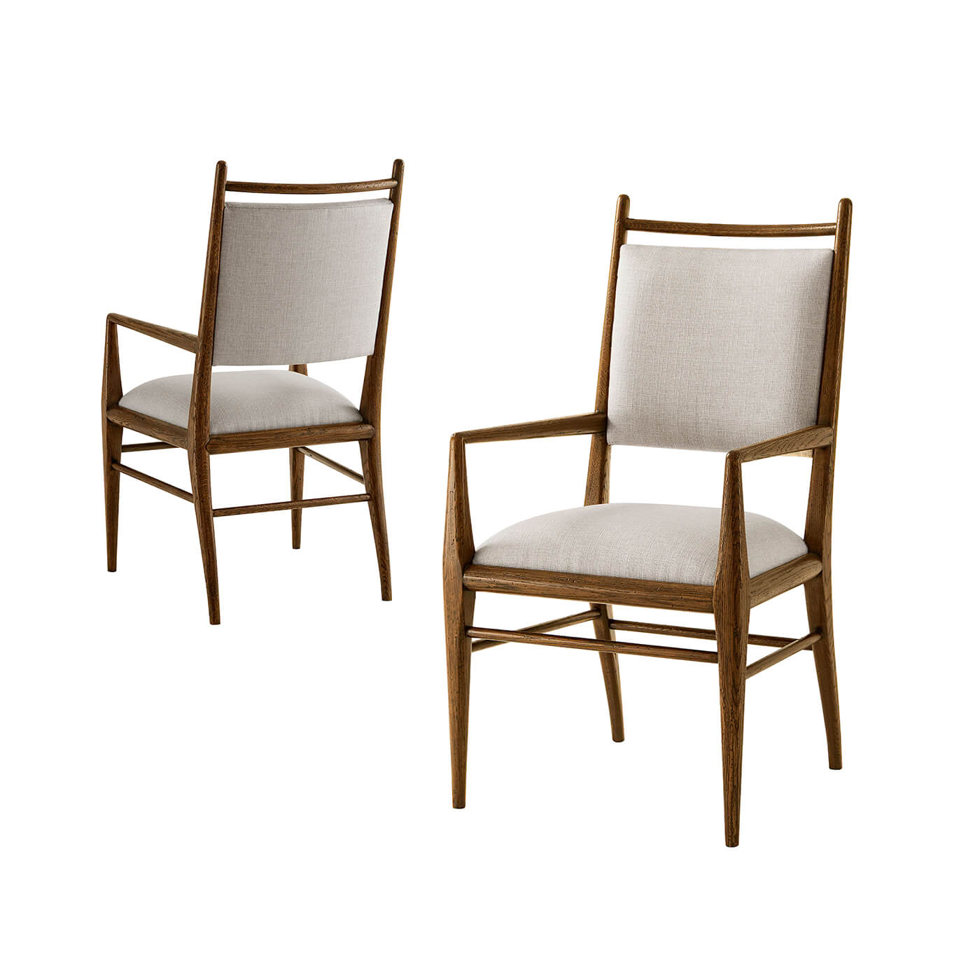 Two oak dining armchairs, front angle view.